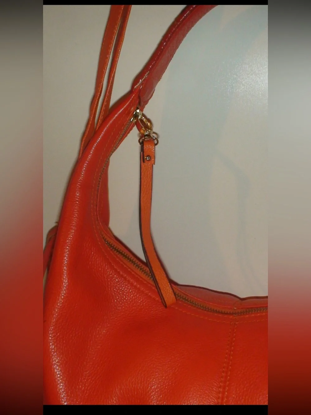 Mulberry Orange Leather Hobo Bag with Tassels and Gold Emblem